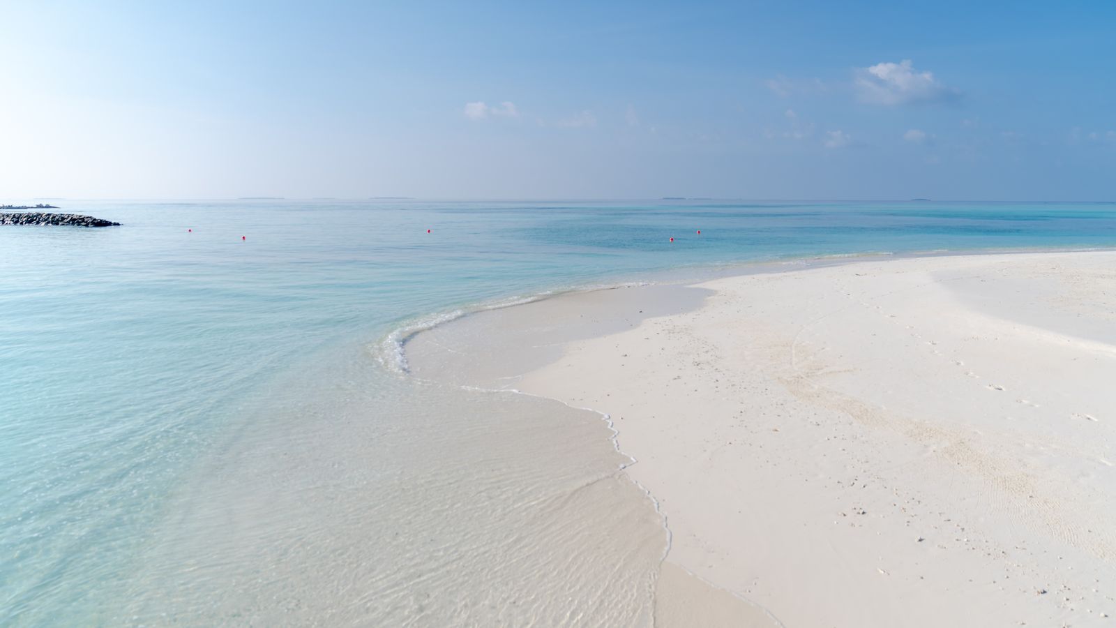 Pristine white sand beach with calm turquoise water — the kind of bay Bãi Khem sits in at the southern tip of Phú Quốc