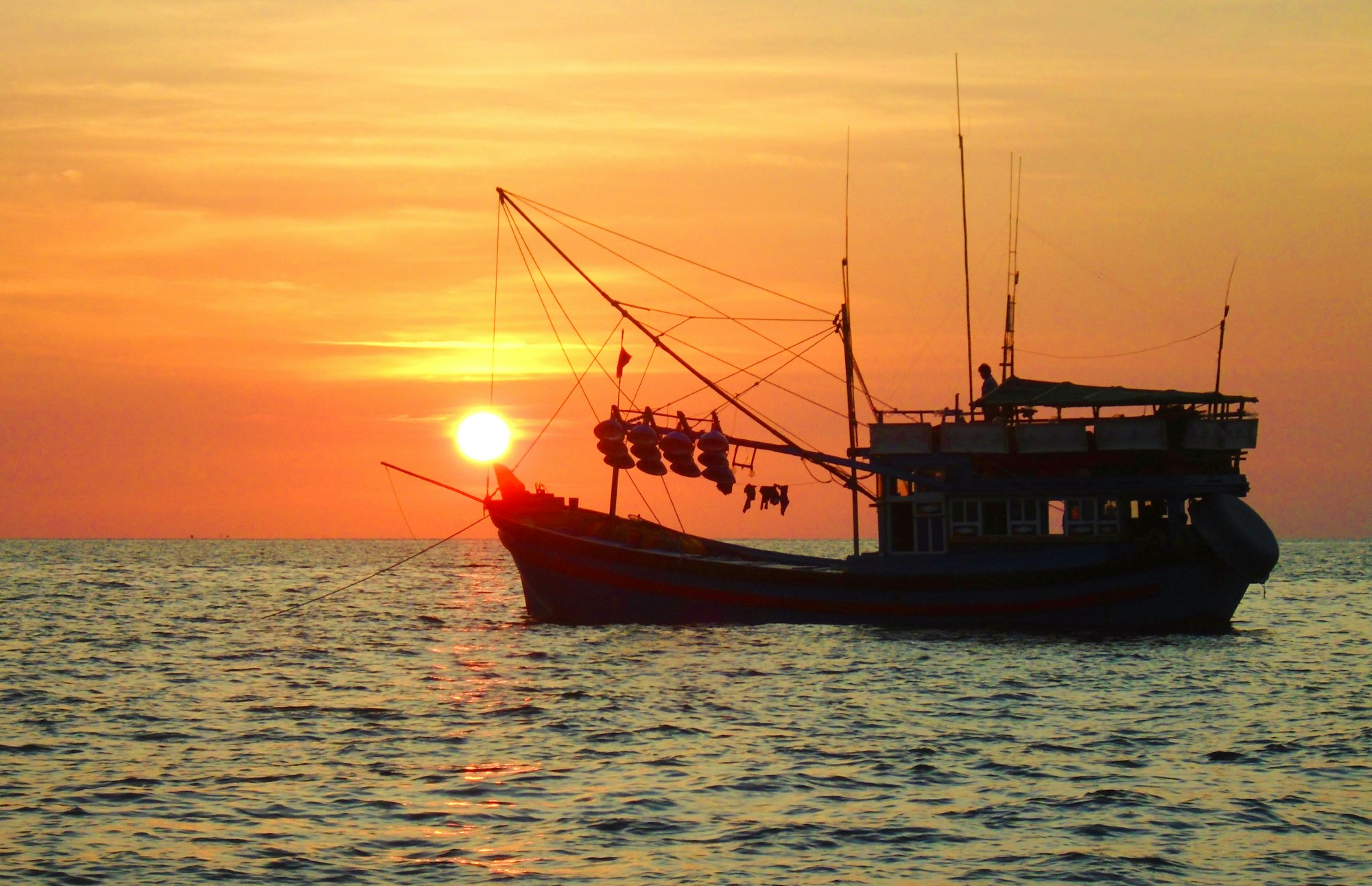 Wooden Phu Quoc fishing boat at sunset near the Bãi Rạch Vẹm coast